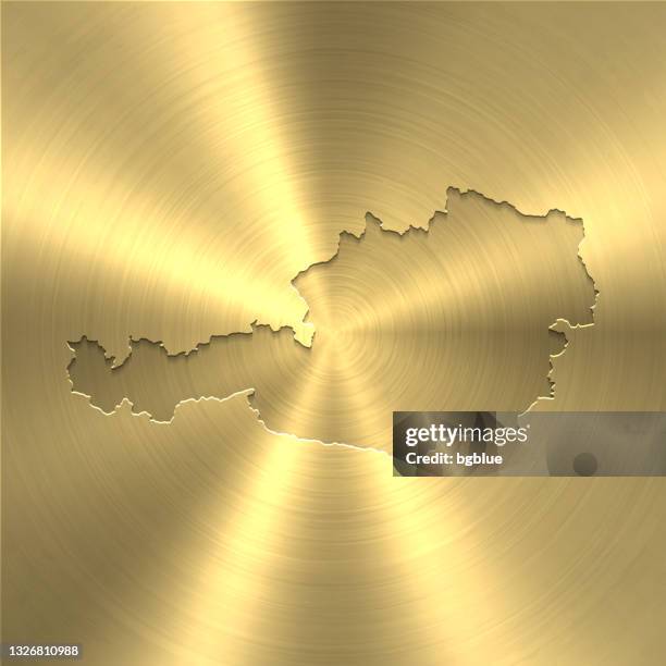 austria map on gold background - circular brushed metal texture - austria border stock illustrations