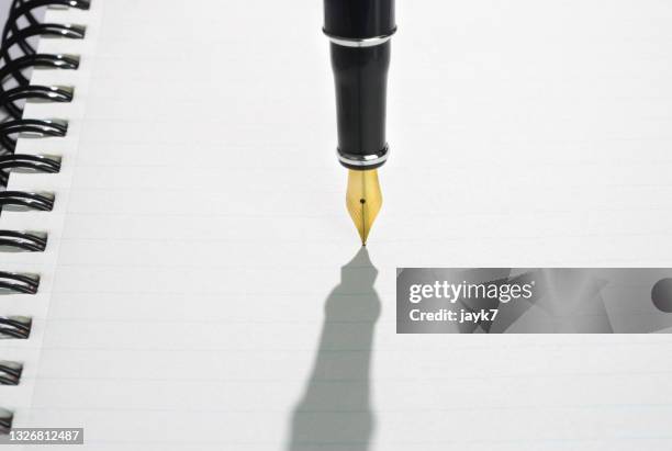 book and pen - fountain pen stock pictures, royalty-free photos & images