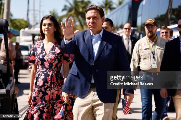 Florida Gov. Ron DeSantis and his wife, Casey, arrive to visit a memorial to those missing outside the 12-story Champlain Towers South condo building...