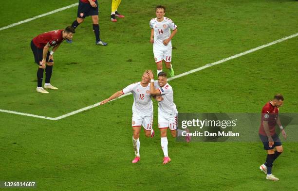 Kasper Dolberg of Denmark celebrates with Jens Stryger Larsen after scoring their side's second goal during the UEFA Euro 2020 Championship...