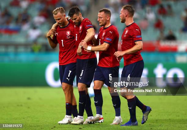 Ondrej Celustka of Czech Republic is helped by team mates Antonin Barak, Vladimir Coufal and Tomas Kalas after an injury during the UEFA Euro 2020...