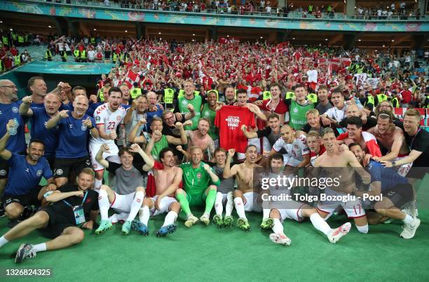 Players of Denmark celebrate their side's victory in front of the fans after the UEFA Euro 2020 Championship Quarter-final match between Czech...