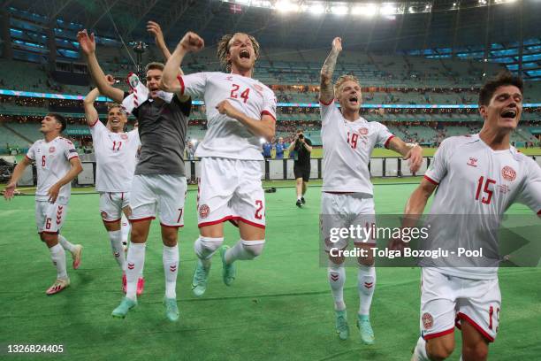 Andreas Christensen, Jens Stryger Larsen, Robert Skov, Mathias Jensen, Daniel Wass and Christian Norgaard of Denmark celebrate their side's victory...