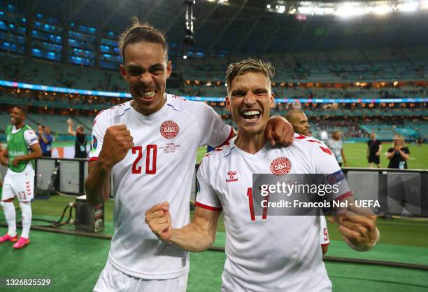 Yussuf Poulsen and Jens Stryger Larsen of Denmark celebrate their side's victory after the UEFA Euro 2020 Championship Quarter-final match between...