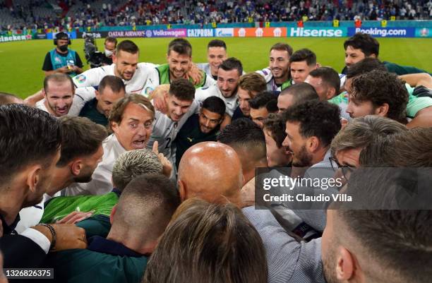 Head coach Italy Roberto Mancini celebrates with players and his staff after the UEFA Euro 2020 Championship Quarter-final match between Belgium and...