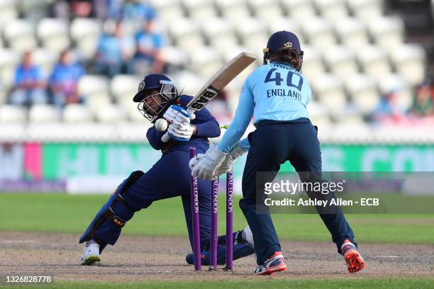 Sneh Rana of India is bowled by Sophie Ecclestone during the Women's Third One Day International match between England and India at New Road on July...