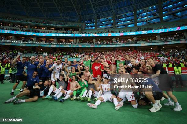 Players of Denmark celebrate their side's victory in front of the fans after the UEFA Euro 2020 Championship Quarter-final match between Czech...