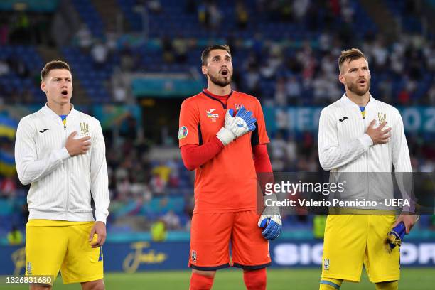 Mykola Matviyenko, Georgiy Bushchan and Andriy Yarmolenko of Ukraine stand for the national anthem prior to the UEFA Euro 2020 Championship...