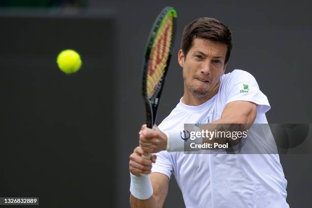 Aljaz Bedene of Slovenia plays a back hand during his men's singles third round match against Matteo Berrettini of Italy during Day Six of The...