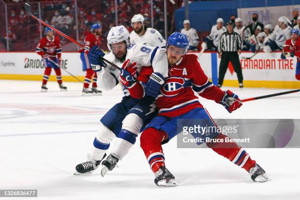 Tyler Johnson of the Tampa Bay Lightning battles with Brendan Gallagher of the Montreal Canadiens during Game Three of the 2021 NHL Stanley Cup Final...