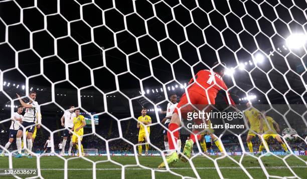 Jordan Henderson of England scores their side's fourth goal past Georgiy Bushchan of Ukraine during the UEFA Euro 2020 Championship Quarter-final...