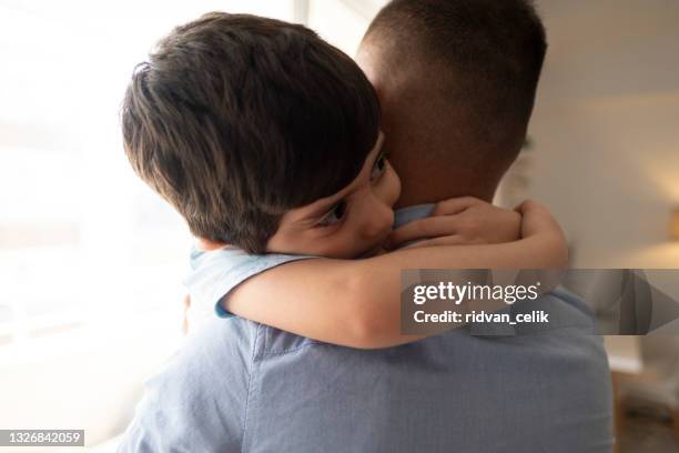 loving father and little son enjoy tender family moment - foster care stock pictures, royalty-free photos & images