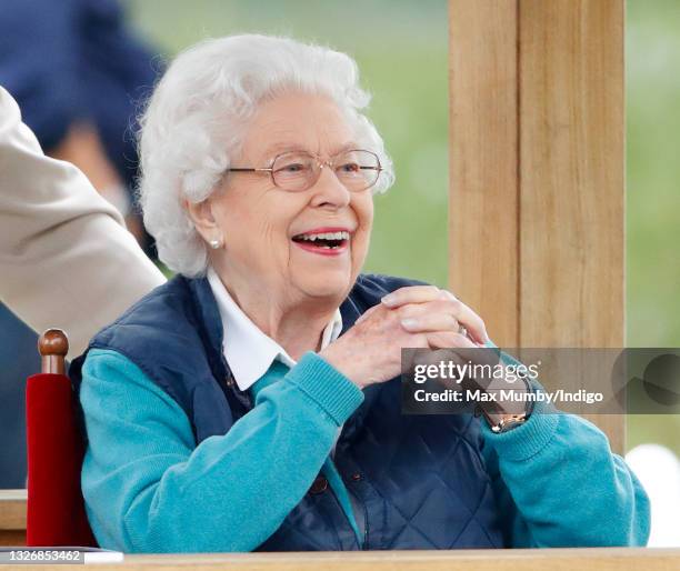 Queen Elizabeth II watches her horse 'First Receiver' compete in and win the Retired Racehorses - RoR Open In Hand Show Series Qualifier Class on day...