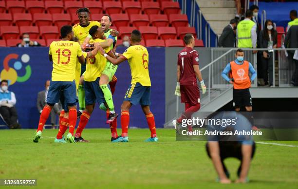 David Ospina of Colombia celebrates with teammates winning a penalty shootout after during a quarter-final match of Copa America Brazil 2021 between...