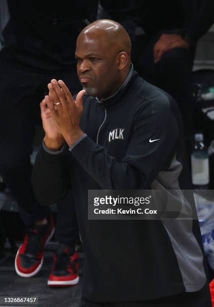 Head coach Nate McMillan of the Atlanta Hawks looks on against the Milwaukee Bucks during the first half in Game Six of the Eastern Conference Finals...