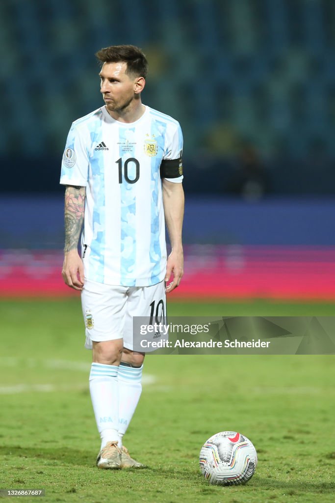 Lionel Messi of Argentina prepares to take a free kick during a... News