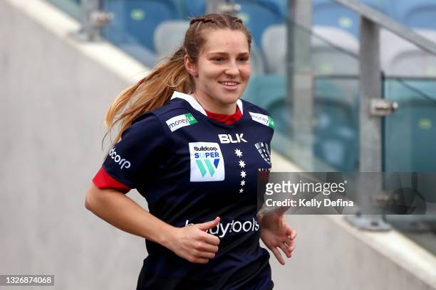 Georgia Cormick of the Rebels runs out during the Super W match between the Melbourne Rebels and the ACT Brumbies at Coffs Harbour International...