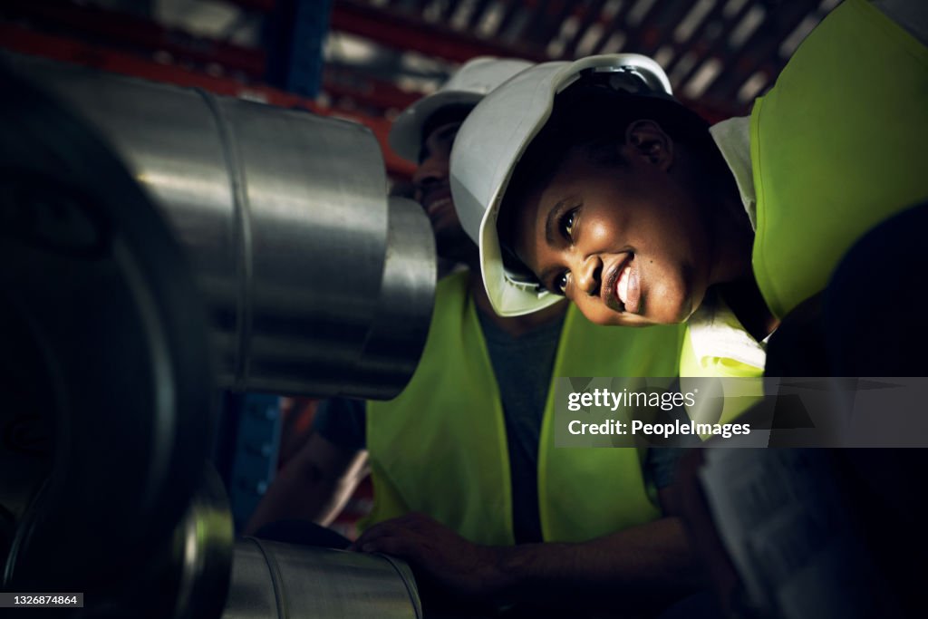 Shot of a young man and woman doing inspections at a construction site