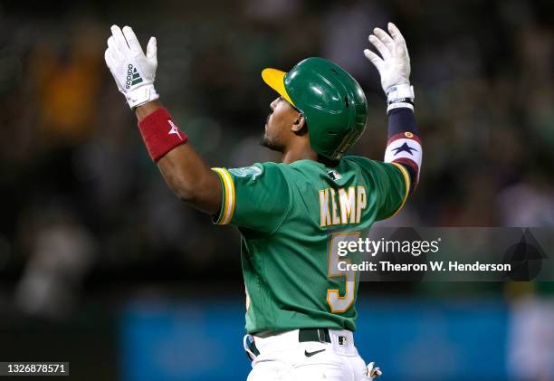 Tony Kemp of the Oakland Athletics celebrates after he hit a walk-off sacrifice fly to score Seth Brown and defeat the Boston Red Sox 7-6 in the...