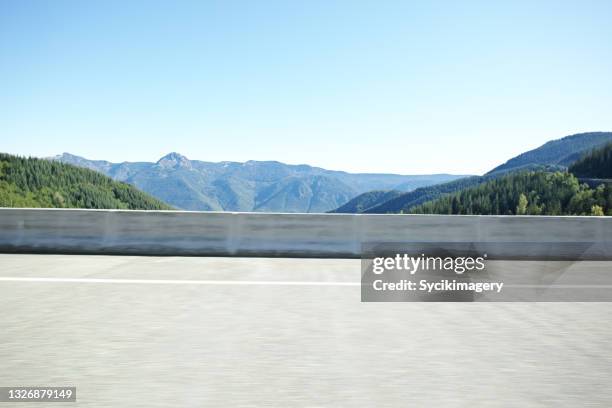 highway roadside profile view - mountain side stock pictures, royalty-free photos & images