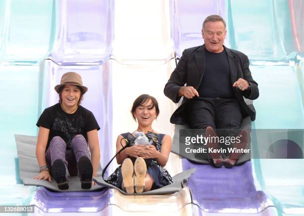 Milo Jacob Manheim, actress Zelda Williams and actor Robin Williams attend the Premiere of Warner Bros. Pictures' "Happy Feet Two" at Grauman's...