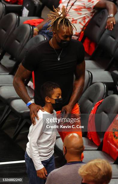 Dwight Howard of the Philadelphia 76ers is seen during the second half with his son David Howard in Game Six of the Eastern Conference Finals between...
