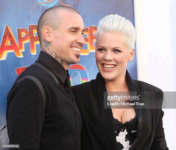 Alecia "Pink" Moore and Carey Hart arrive at the Los Angeles premiere of "Happy Feet Two" held at Grauman's Chinese Theatre on November 13, 2011 in...