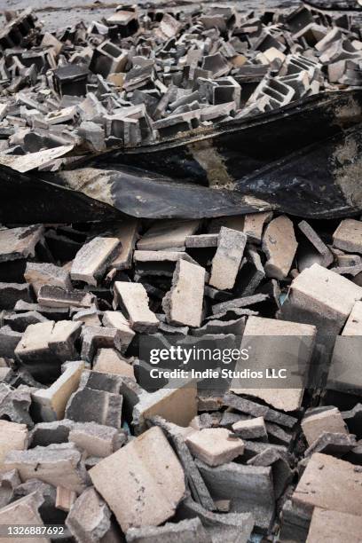 cinderblocks and other building parts from a burnt building - cinder block stock pictures, royalty-free photos & images