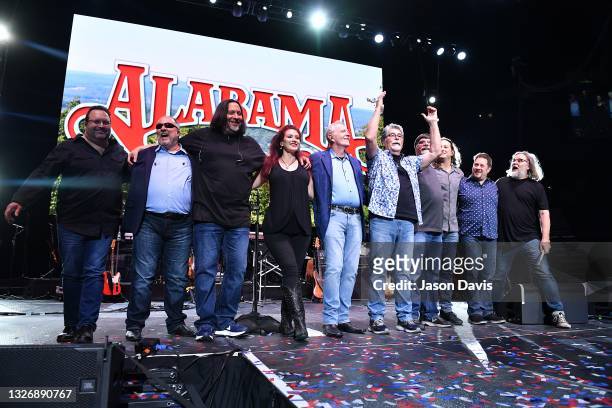 Randy Owen and Teddy Gentry of Alabama take a bow with the supporting musicians during the Alabama 50th Anniversary Tour Opening Weekend at...