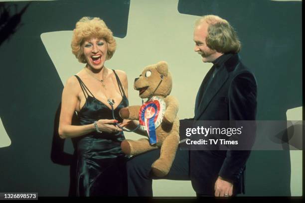 Ventriloquist Roger De Courcey with his puppet Nookie Bear and entertainer Faith Brown, circa 1982.