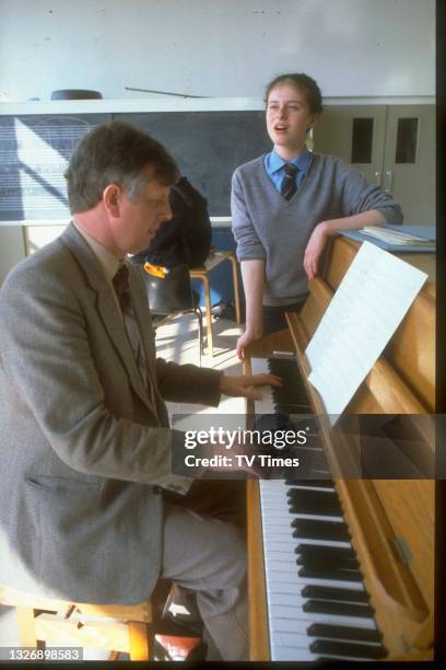 English singer Lisa Stansfield photographed with her music teacher at school, circa 1981.