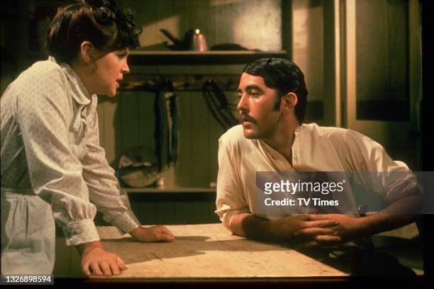 Actors Pauline Collins and John Alderton in character as Sarah and Thomas on the set of period drama Upstairs, Downstairs, circa 1973.
