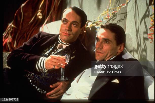 Actors Nickolas Grace and Jeremy Irons in character as Anthony Blanche and Charles Ryder on the set of period drama Brideshead Revisited, circa 1981.