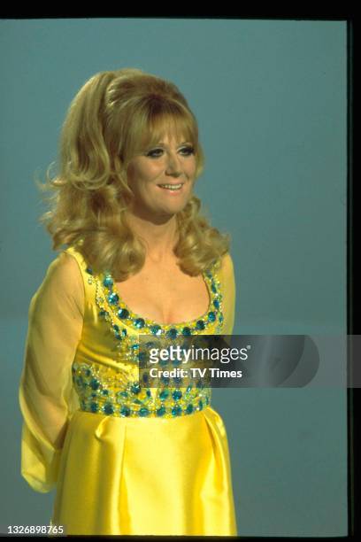 English pop singer Dusty Springfield performing on stage during an appearance on The Des O'Connor Show, circa 1970.