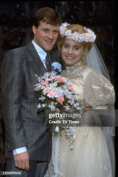 Actors Ian Sharrock and Malandra Burrows in character as newlyweds Jackie Merrick and Kathy Bates in television soap Emmerdale Farm, circa 1988.