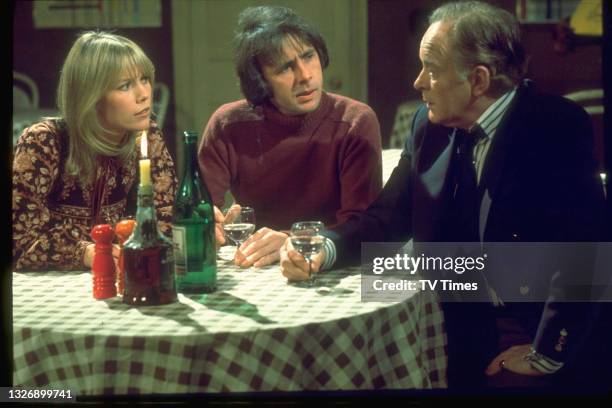 Tessa Wyatt, Richard O'Sullivan and Tony Britton in charcter as Vicky, Robin and James on the set of sitcom Robin's Nest, circa 1980.