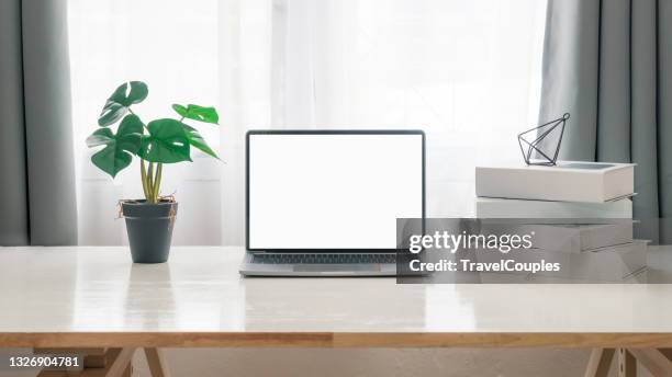 workplace with laptop on table at home. laptop with blank screen on white table. home interior or office background - coffee cup mockup stock pictures, royalty-free photos & images