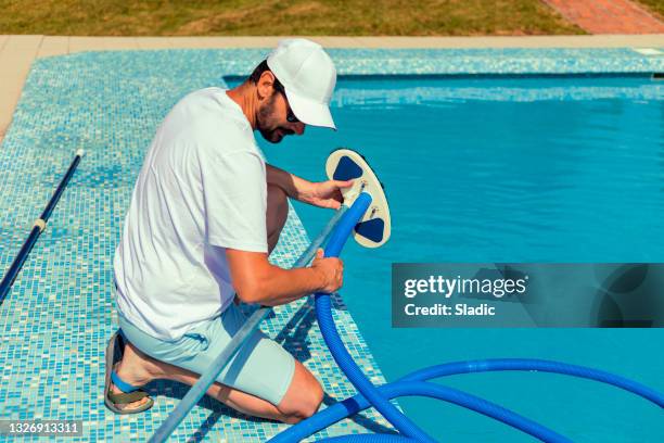 Working In A Pool 1,238 Swimming Pool Staff Stock Photos, High-Res Pictures, and Images ...