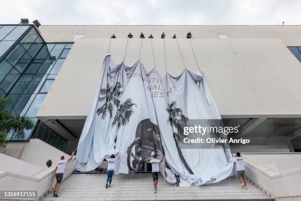 The poster for the 74th Annual Cannes Film Festival is installed at Palais des Festivals on July 4, 2021 in Cannes, France.