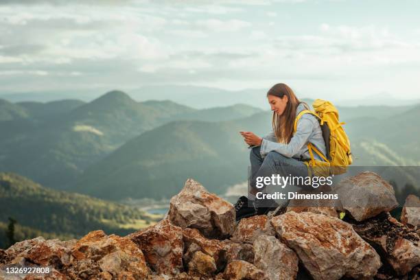 this is where she goes to relax - woman smartphone nature stock pictures, royalty-free photos & images