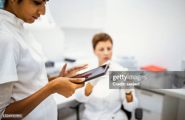 scientists working in the laboratory - biomarker stock pictures, royalty-free photos & images