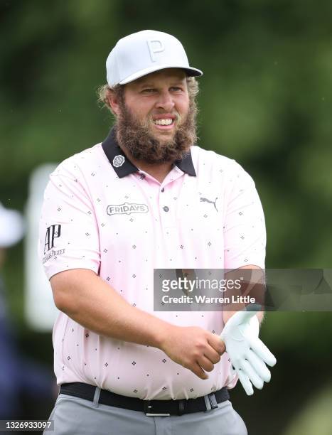 Andrew Johnston of England puts on his golf glove on the first hole during final round of The Dubai Duty Free Irish Open at Mount Juliet Golf Club on...