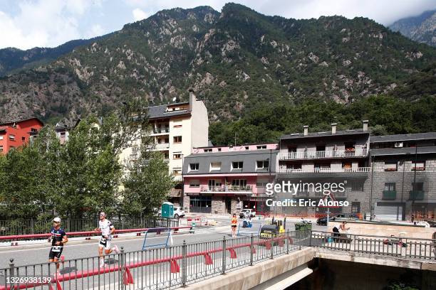 Athletes compete during the run leg of IRONMAN Andorra on July 04, 2021 in Andorra la Vella, Andorra.