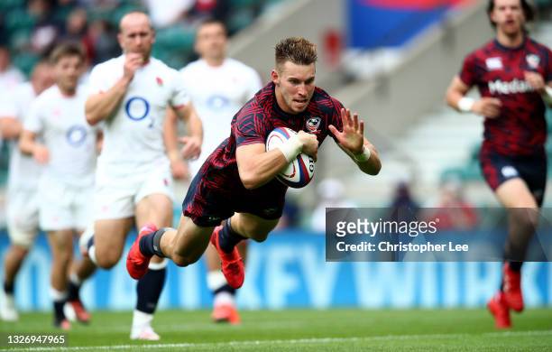Christian Dyer of the USA dives to score a try during the Summer International Rugby Union match between England and USA at Twickenham Stadium on...