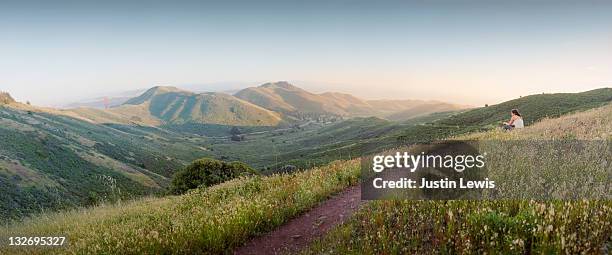 panorama with hiker sitting on trail - marin stock pictures, royalty-free photos & images