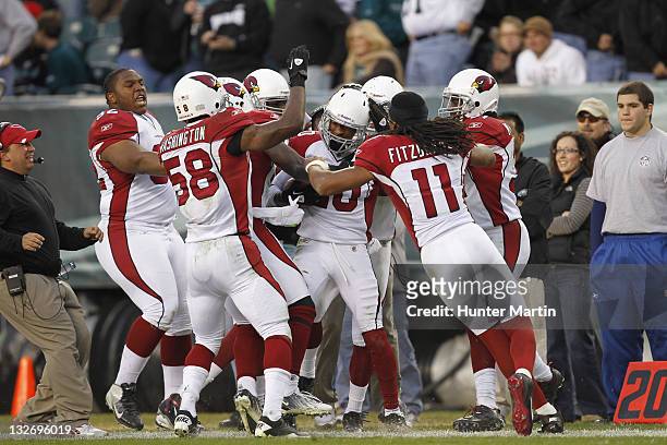 Cornerback A.J. Jefferson of the Arizona Cardinals is mobbed by teammates after intercepting a game ending pass during a game against the...