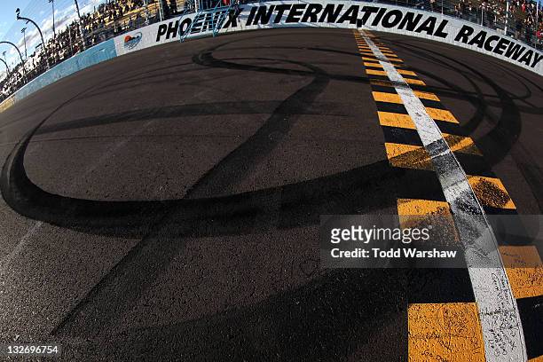 View of tire tracks following a burnout by Kasey Kahne, driver of the Red Bull Toyota, after winning the NASCAR Sprint Cup Series Kobalt Tools 500 at...