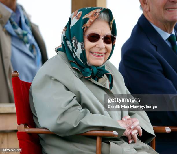 Queen Elizabeth II watches her horse 'Daydream III' compete in and win the 'Intermediate Show Riding Type' class on day 4 of the Royal Windsor Horse...