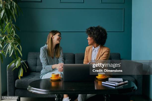 two minds are better than one - women talking in a bank with computer stock pictures, royalty-free photos & images