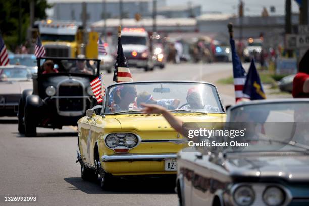 Classic car owners participate in the Independence Day parade as it rolls down Main Street on July 04, 2021 in Sweetwater, Tennessee. Cities and...